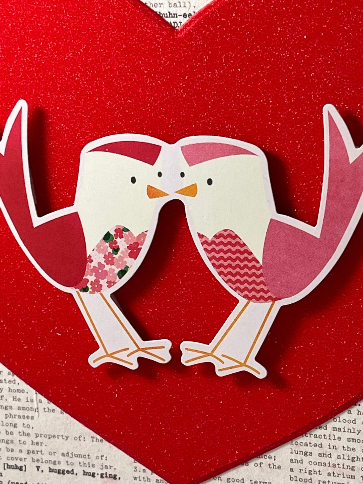 Two little lovebirds sitting in a tree... Kissing... Spread some love with these cute birdies on gorgeous glitter card