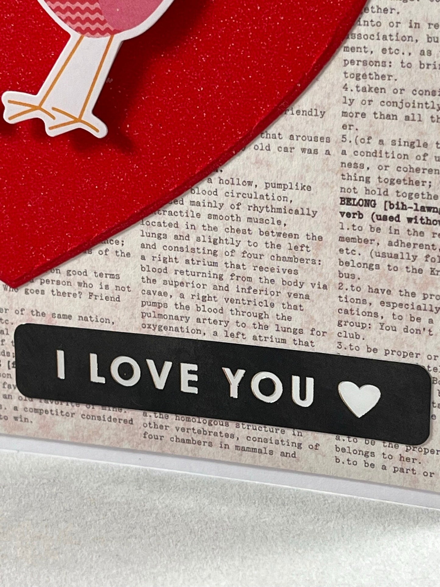 Two little lovebirds sitting in a tree... Kissing... Spread some love with these cute birdies on gorgeous glitter card