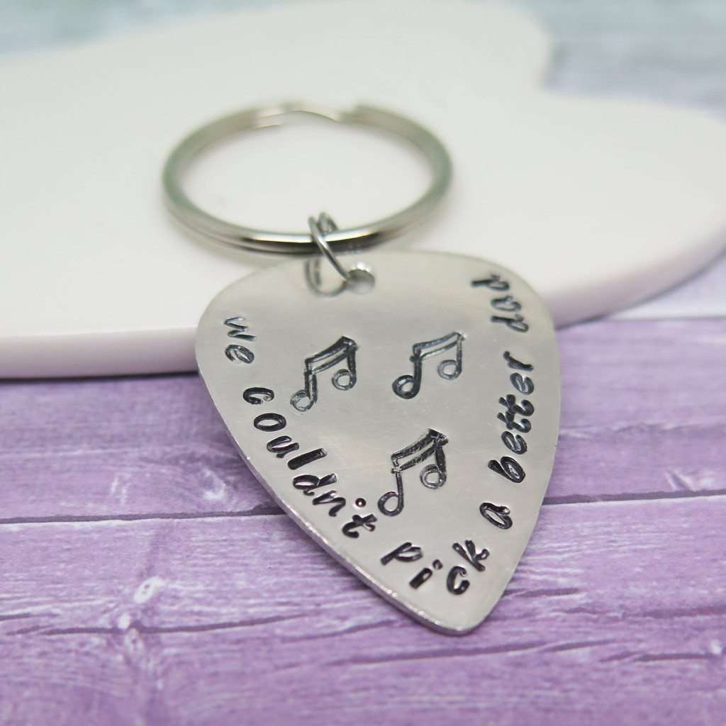 Guitar Pick hand stamped with 'We couldn't pick a better Dad'